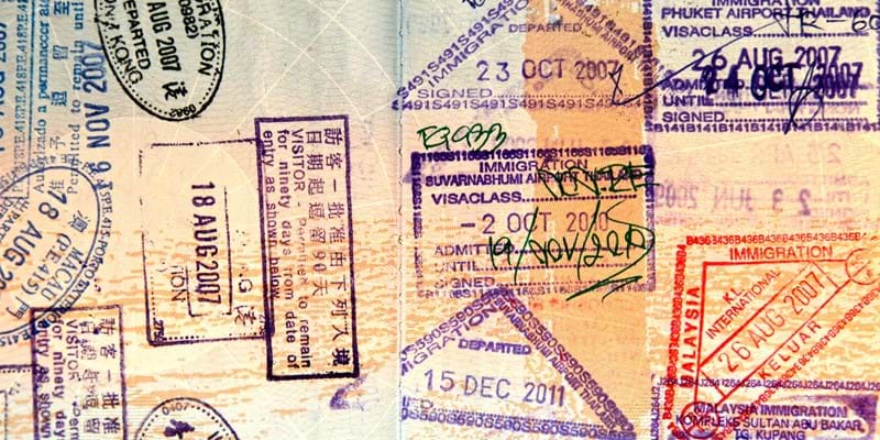 Detail view of passport with multiple stamps