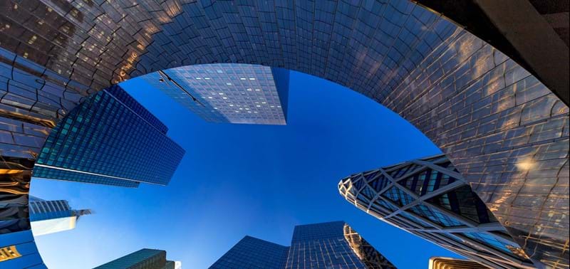 Curved buildings reflecting each other in Paris' financial district