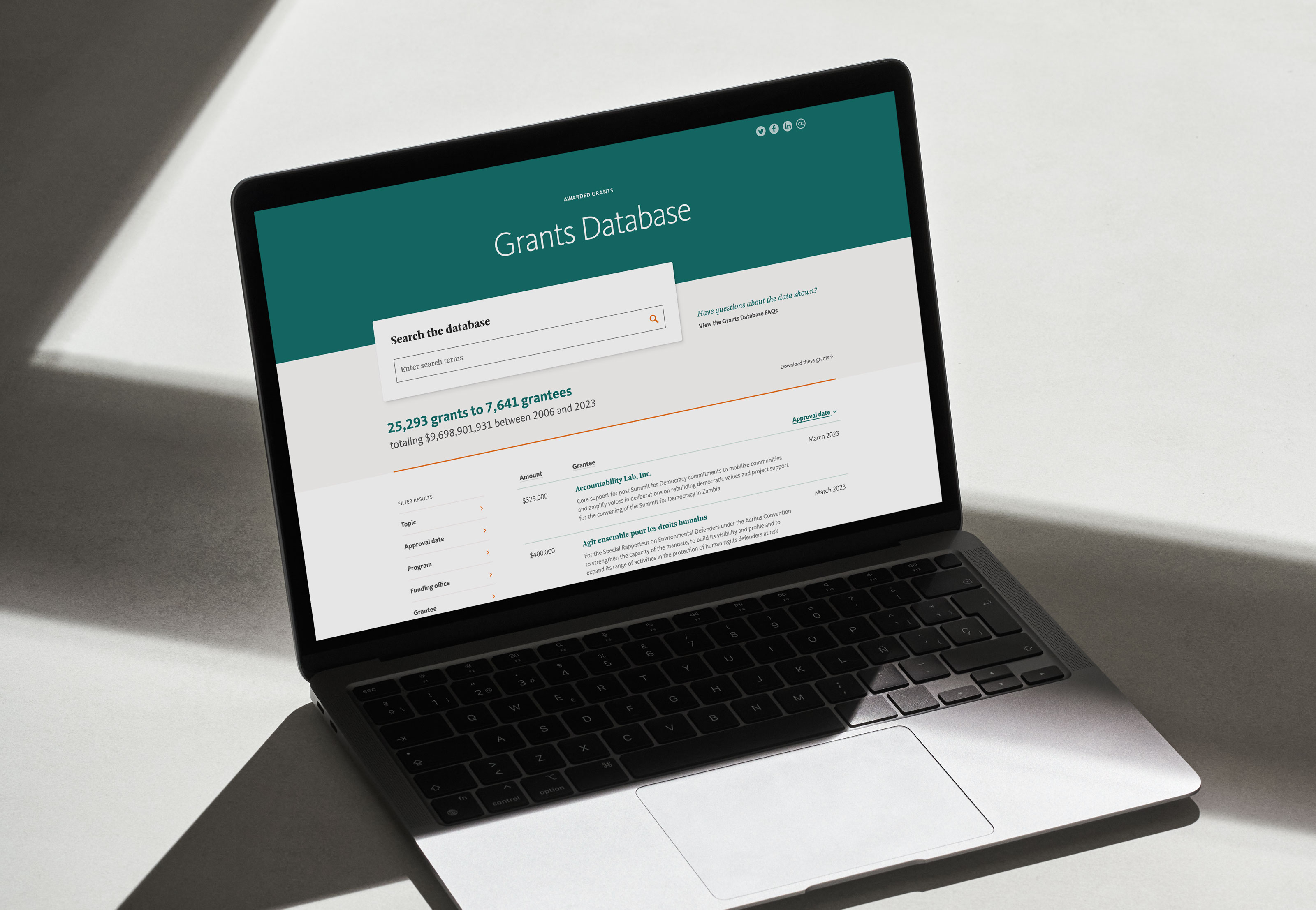 Laptop with Grants Database onscreen